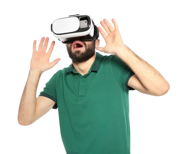 Jovem emotivo jogando videogames com fone de ouvido de realidade virtual isolado em branco — Fotografia de Stock