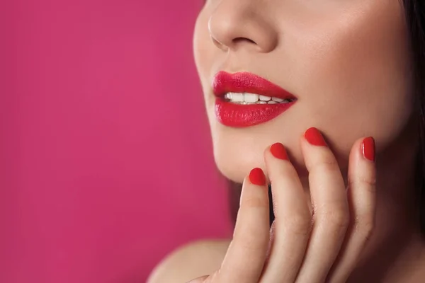 Beautiful woman with stylish nail polish on color background, closeup. Space for text — Stock Photo, Image