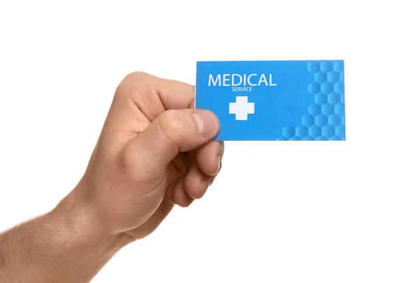 Homem segurando cartão de visita isolado em branco, close up. Serviço médico — Fotografia de Stock