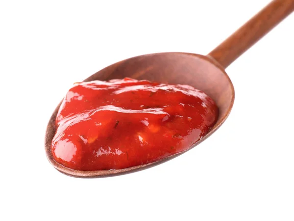 Wooden spoon with red sauce on white background — 스톡 사진