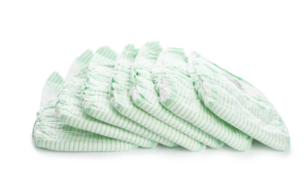 Montón de pañales desechables sobre fondo blanco. Accesorios para bebés —  Fotos de Stock
