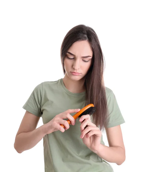 Junge Frau mit Pinsel auf weißem Hintergrund. Haarausfall — Stockfoto