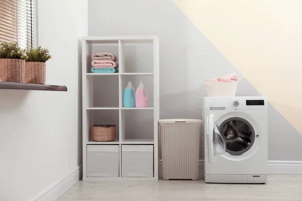 Modern washing machine in laundry room interior — Stock Photo, Image
