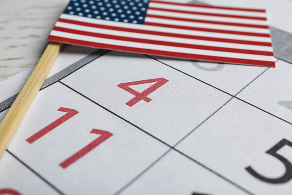 Composition with USA flag and calendar on  table, closeup. Happy Independence Day