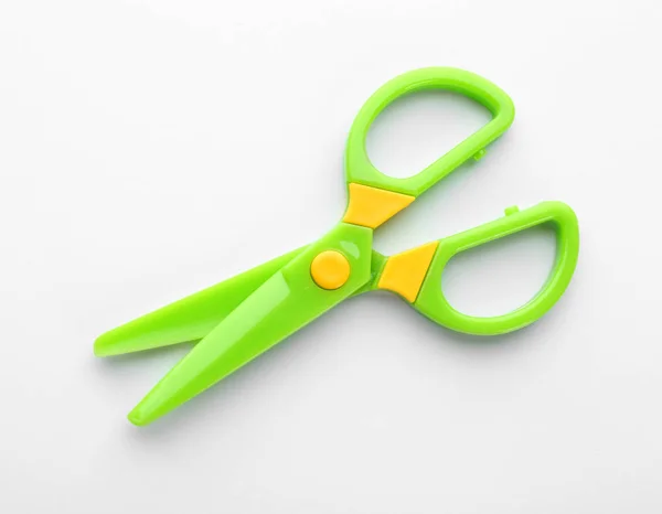 Colorful plastic scissors on white background. School stationery — Stock Photo, Image