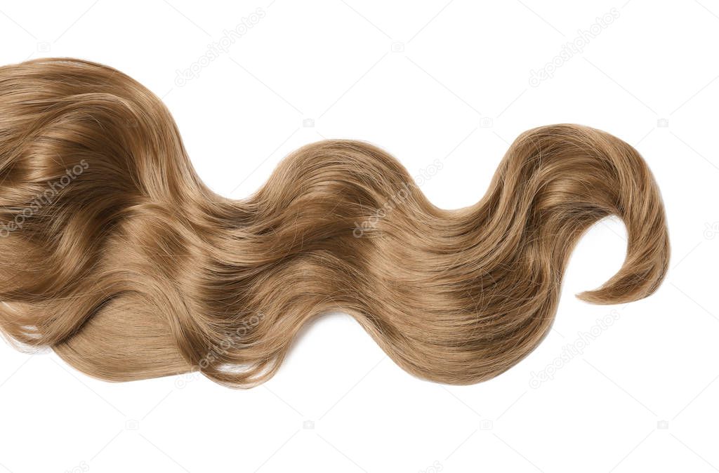 Lock of brown wavy hair on white background, top view