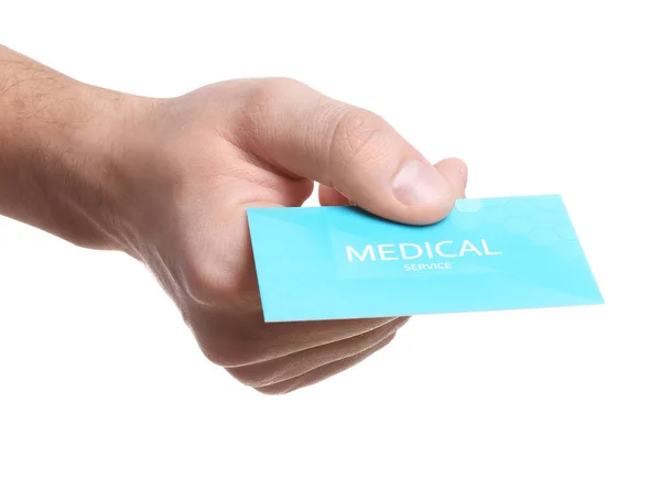 Człowiek trzyma wizytówkę na białym tle, zbliżenie. Usługi medyczne — Zdjęcie stockowe