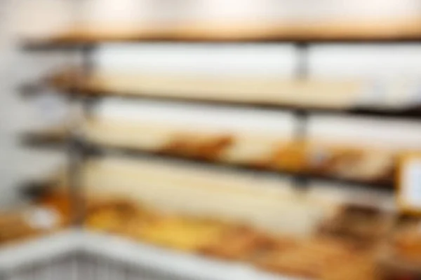 Blurred view of bakery store with pastries — Stock Photo, Image