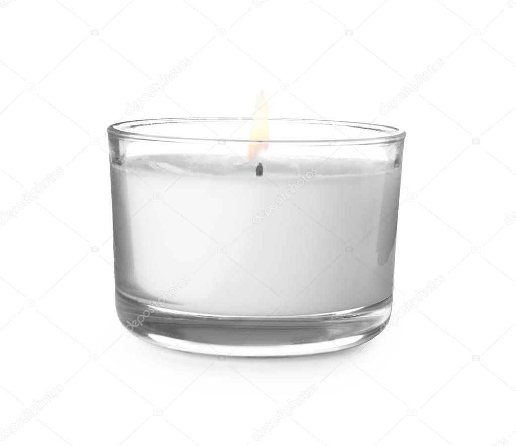 Wax candle in glass holder on white background