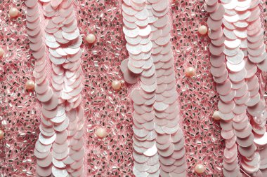 Arka plan olarak güzel payetler ile şık altın gül kumaş