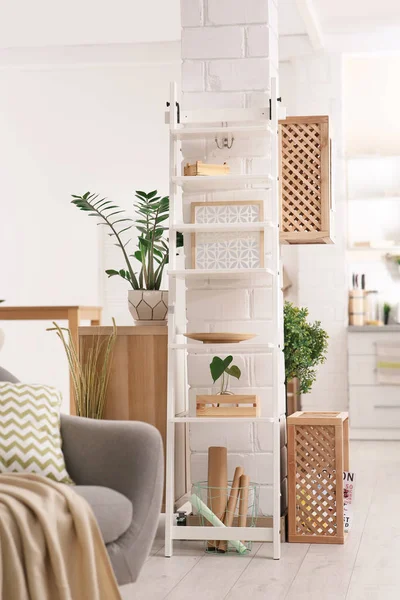 Modern eco style interior with wooden crates and shelves