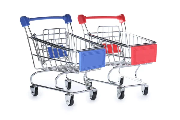 Empty metal shopping trolleys isolated on white — Stock Photo, Image