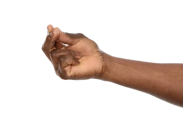 Afrikanisch-amerikanischer Mann hält etwas in der Hand auf weißem Hintergrund, Nahaufnahme — Stockfoto