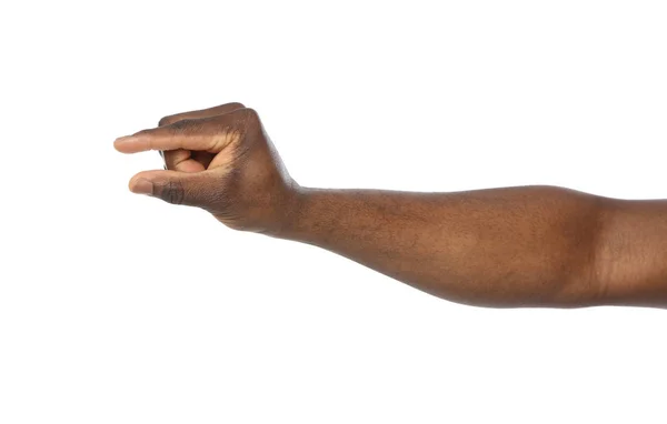 Hombre afroamericano sosteniendo algo en la mano sobre fondo blanco, primer plano —  Fotos de Stock