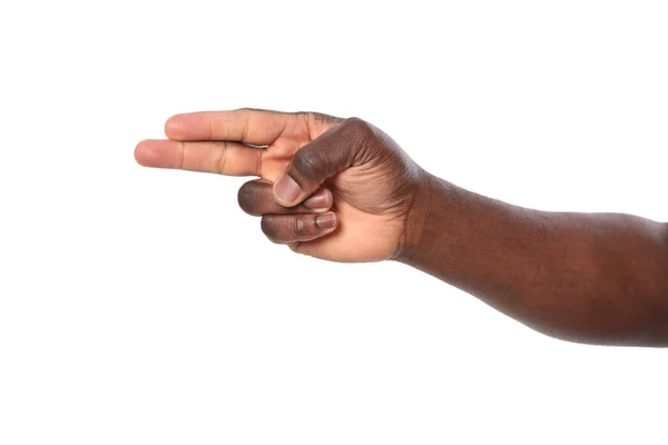 Afroameričan zobrazující gesto střílejí na bílém pozadí, zaostřená — Stock fotografie