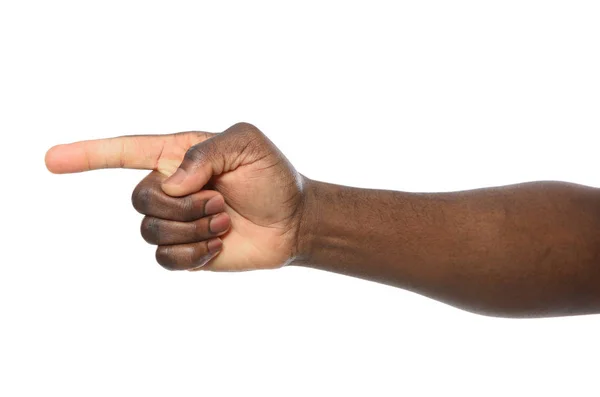 Uomo afro-americano che indica qualcosa su sfondo bianco, primo piano — Foto Stock