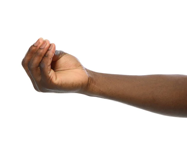 African-American man holding something in hand on white background, closeup — Stock Photo, Image