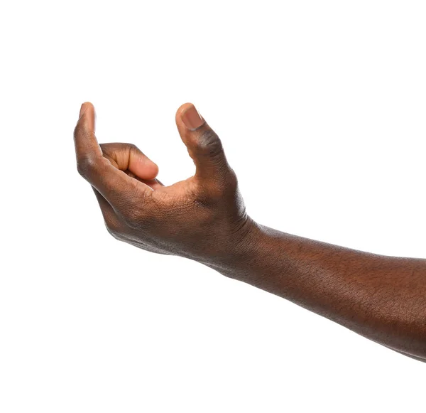 African-American mężczyzna trzyma coś w ręku na białym tle, zbliżenie — Zdjęcie stockowe