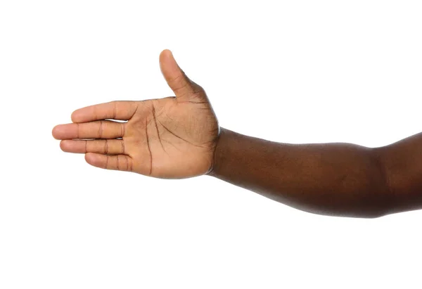 Hombre afroamericano extendiendo la mano para agitar sobre fondo blanco, primer plano — Foto de Stock