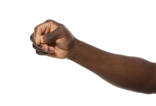 Africano-americano homem segurando algo na mão no fundo branco, close-up — Fotografia de Stock