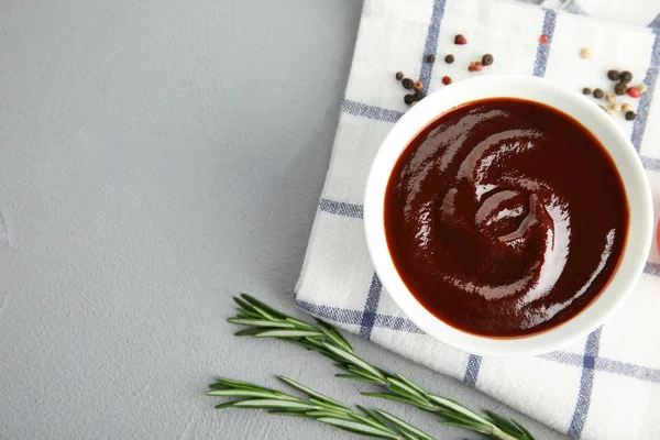 Flat lay composition with barbecue sauce on grey background. Space for text — Stock Photo, Image