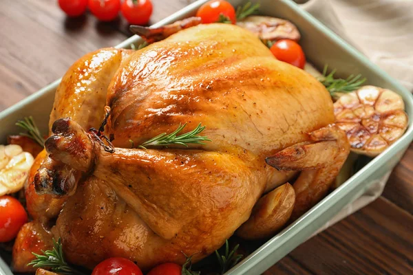 Cooked turkey with vegetables and rosemary in dish on table, closeup — Stock Photo, Image