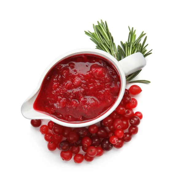 Pitcher of cranberry sauce with rosemary on white background, top view — Stock Photo, Image