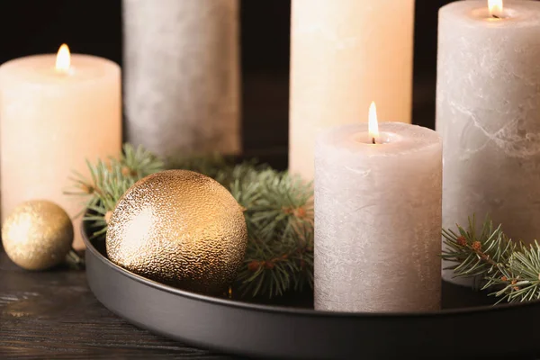 Burning candles with Christmas decoration on table, closeup — Stock Photo, Image