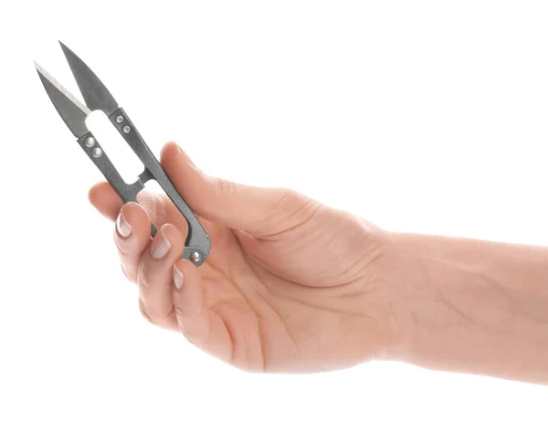 Woman holding pair of sewing scissors on white background, closeup — 스톡 사진