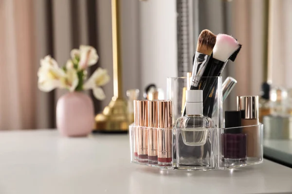Luxury makeup products and accessories on dressing table with mirror. Space for text — Stock Photo, Image