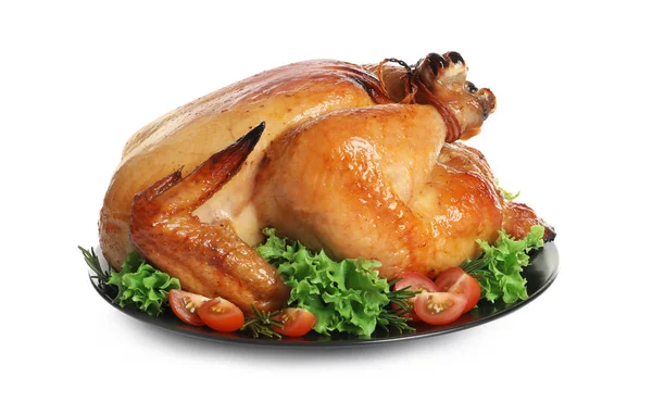 Platter of cooked turkey with garnish on white background Stock Photo