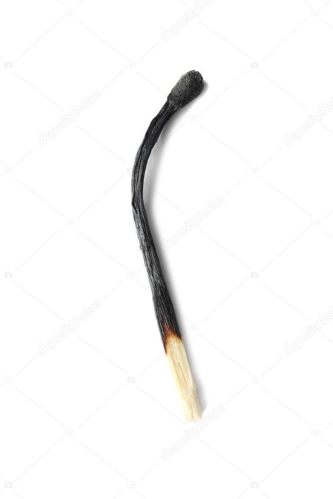 One black burnt match on white background