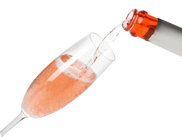 Champán rosa que vierte de botella en vidrio aislado en blanco —  Fotos de Stock