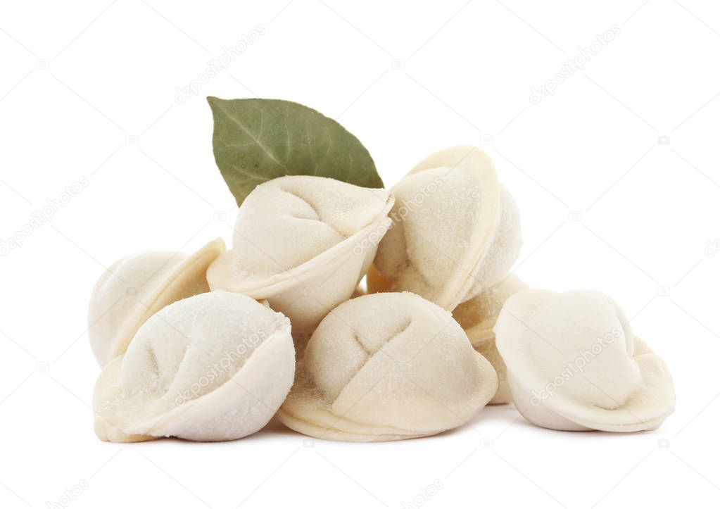 Raw meat dumplings with bay leaf on white background