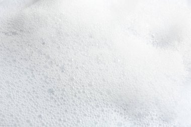 Arka plan olarak yumuşak beyaz sabun köpük, closeup