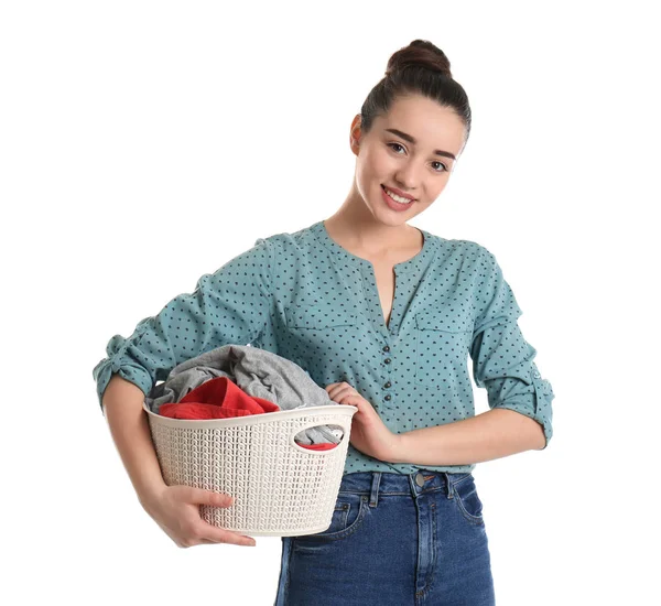 Happy young woman holding basket with laundry on white background — Stock Photo, Image