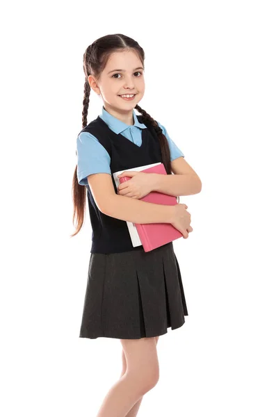 Retrato de linda chica en uniforme escolar con libros sobre fondo blanco —  Fotos de Stock