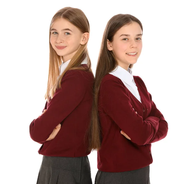 Retrato de chicas adolescentes en uniforme escolar sobre fondo blanco —  Fotos de Stock