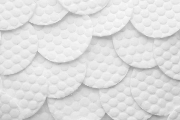 Muchas almohadillas de algodón como fondo, vista superior — Foto de Stock