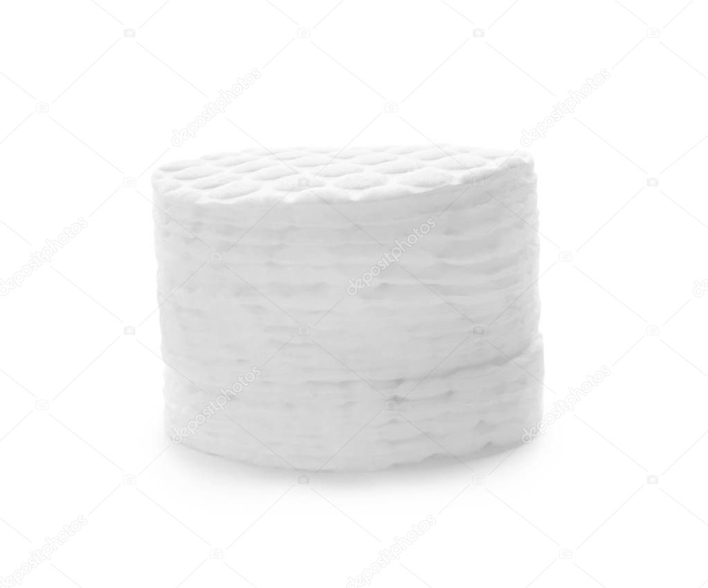 Stack of cotton pads on white background