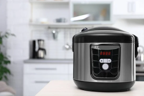 Modern multi cooker on table in kitchen. Space for text — Stock Photo, Image