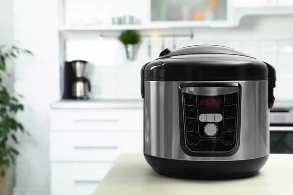 Modern multi cooker on table in kitchen. Space for text — Stock Photo, Image