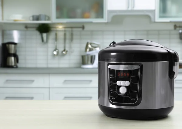 Modern multi cooker on table in kitchen. Space for text — Stock Photo, Image