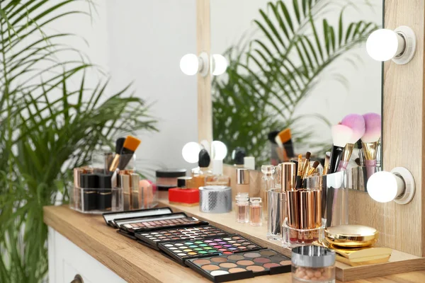 Set of luxury makeup products and accessories on dressing table with mirror. Space for text — Stock Photo, Image