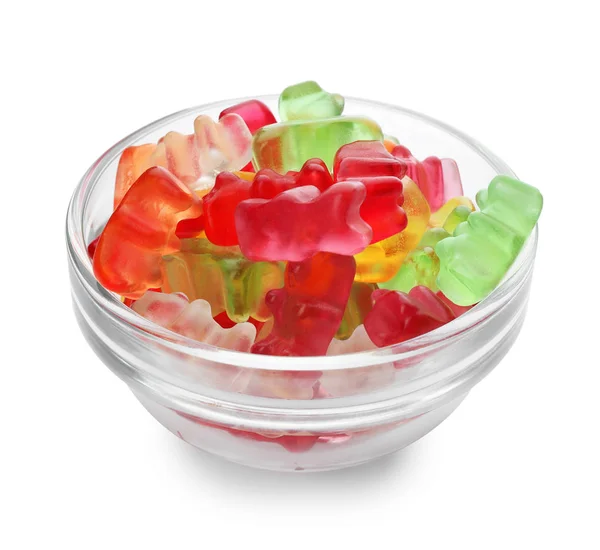 Glasschale mit leckeren Gummibärchen auf weißem Hintergrund — Stockfoto