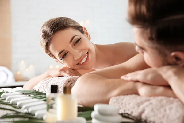 Romantic young couple relaxing in spa salon — Stock Photo, Image