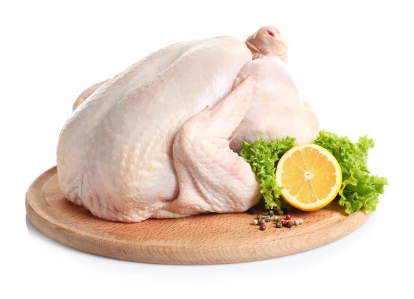 Wooden board with raw turkey and ingredients on white background — Stock Photo, Image