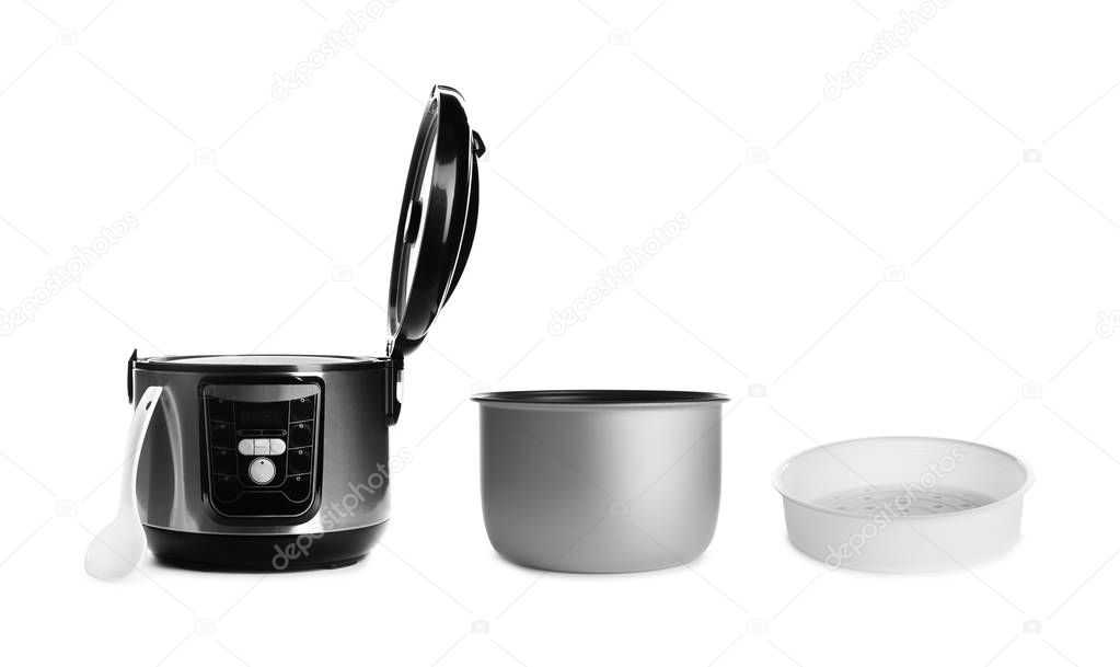 Modern electric multi cooker and accessories on white background