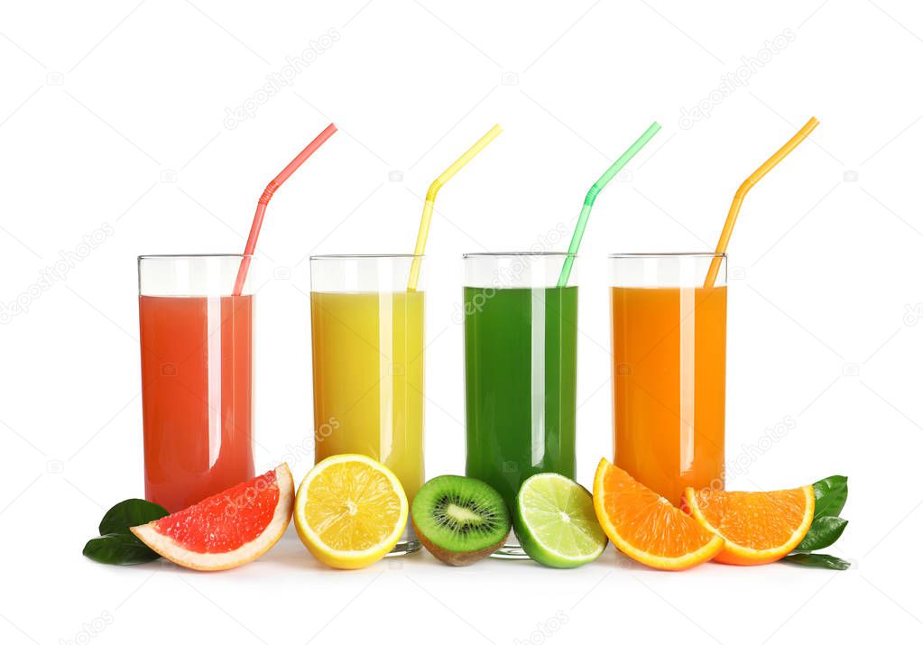 Glasses with different juices and fresh fruits on white background