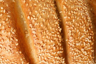 Arka plan olarak susam ile lezzetli ekmek, closeup